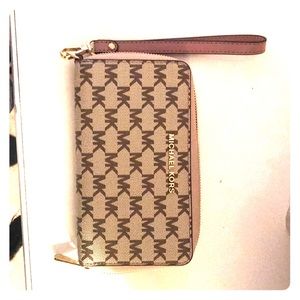 Michael Kors multi colored tan wristlet.
